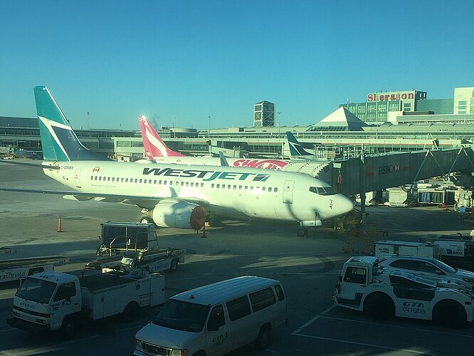WestJet airplane Toronto Pearson Airport Bahamas beach